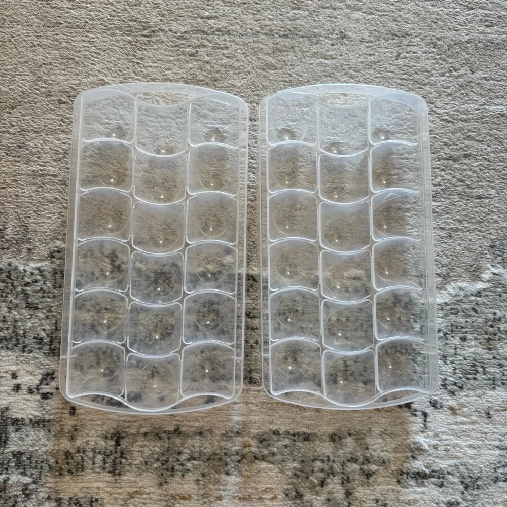 Bundle of 2 ice cube trays and plastic storage bin